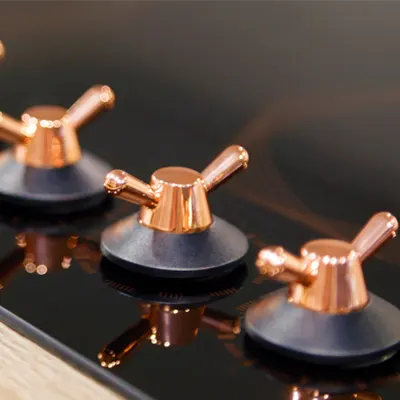 copper-knobs-on-oven