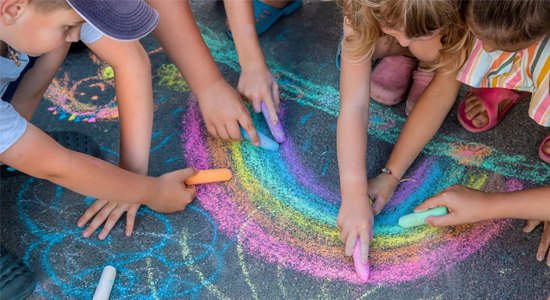 Children-Drawing-on-Asphalt-Sidewalk-Chalk