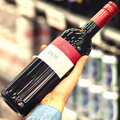 holding-red-wine-bottle
