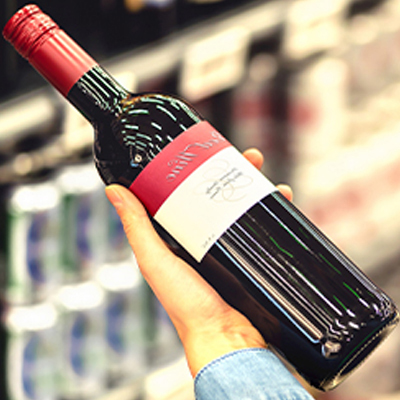 holding-red-wine-bottle
