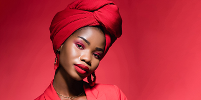 woman-wearing-turban-wearing-magenta-makeup