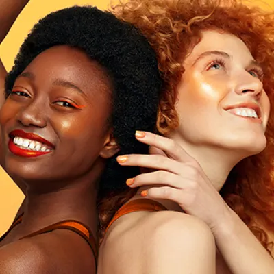 Two-Women-Wearing-Orange-Makeup
