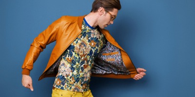 man-flashes-jacket-colorful-shirt-yellow-pants
