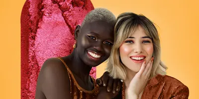 two-women-smiling-background-of-effect-pink-pigment
