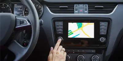 finger-touches-touchscreen-in-car