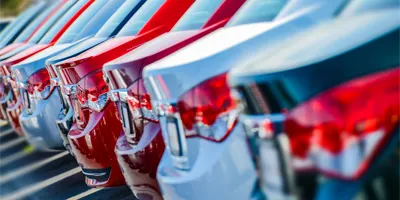 row-of-cars-at-dealership