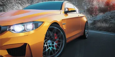 golden-shaded-car-in-mountains
